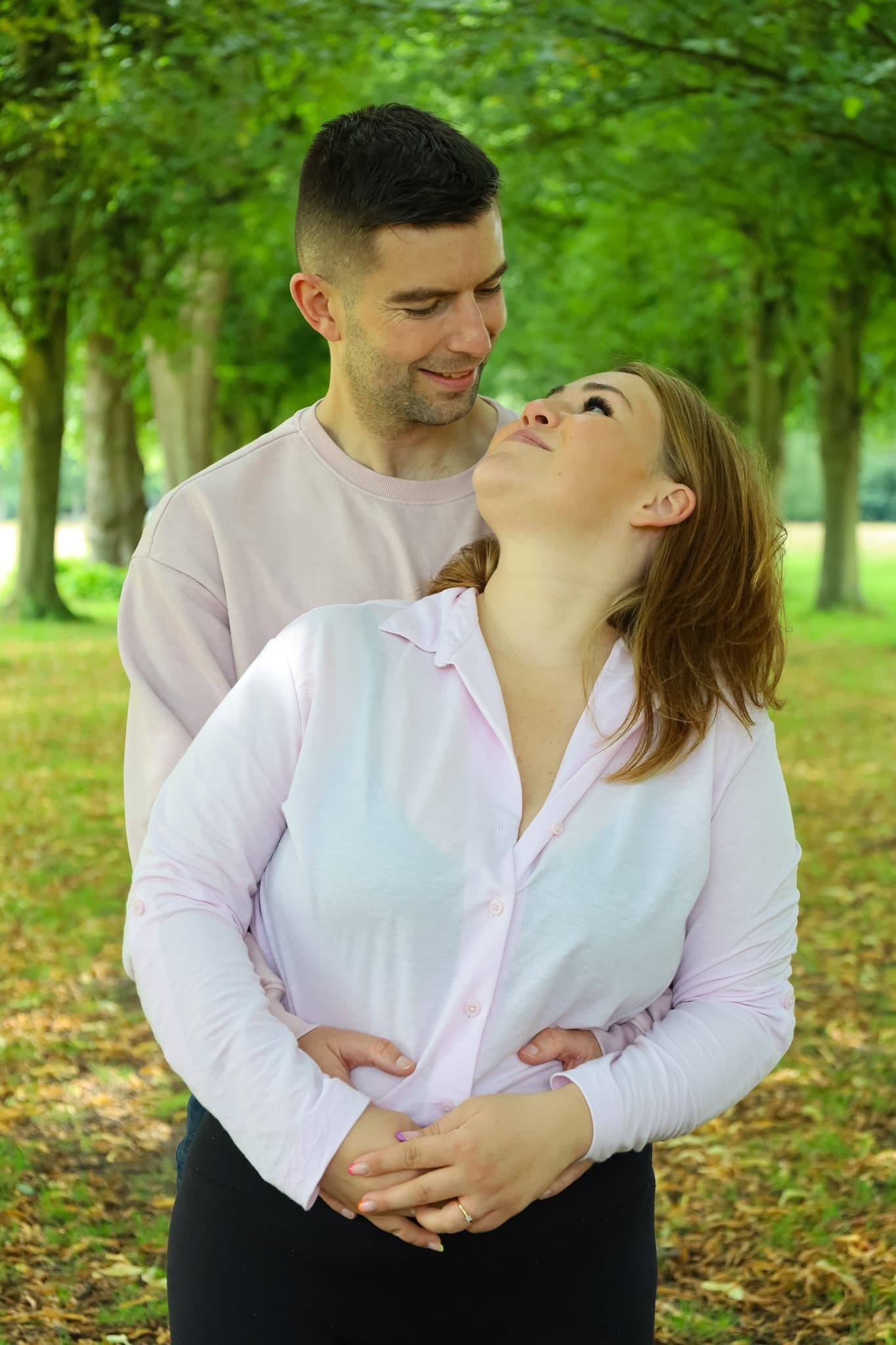 Couple portrait in tree-lined park