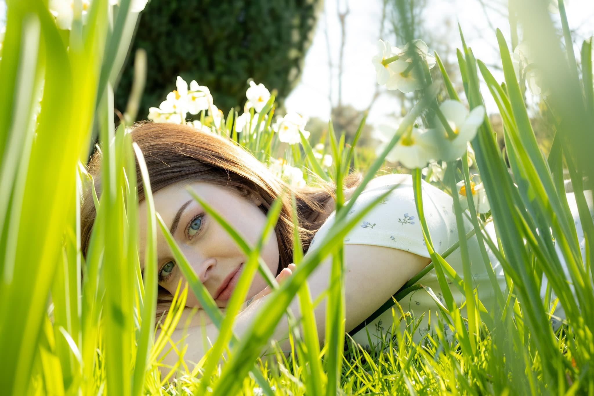 Creative portrait in spring grass — natural light
